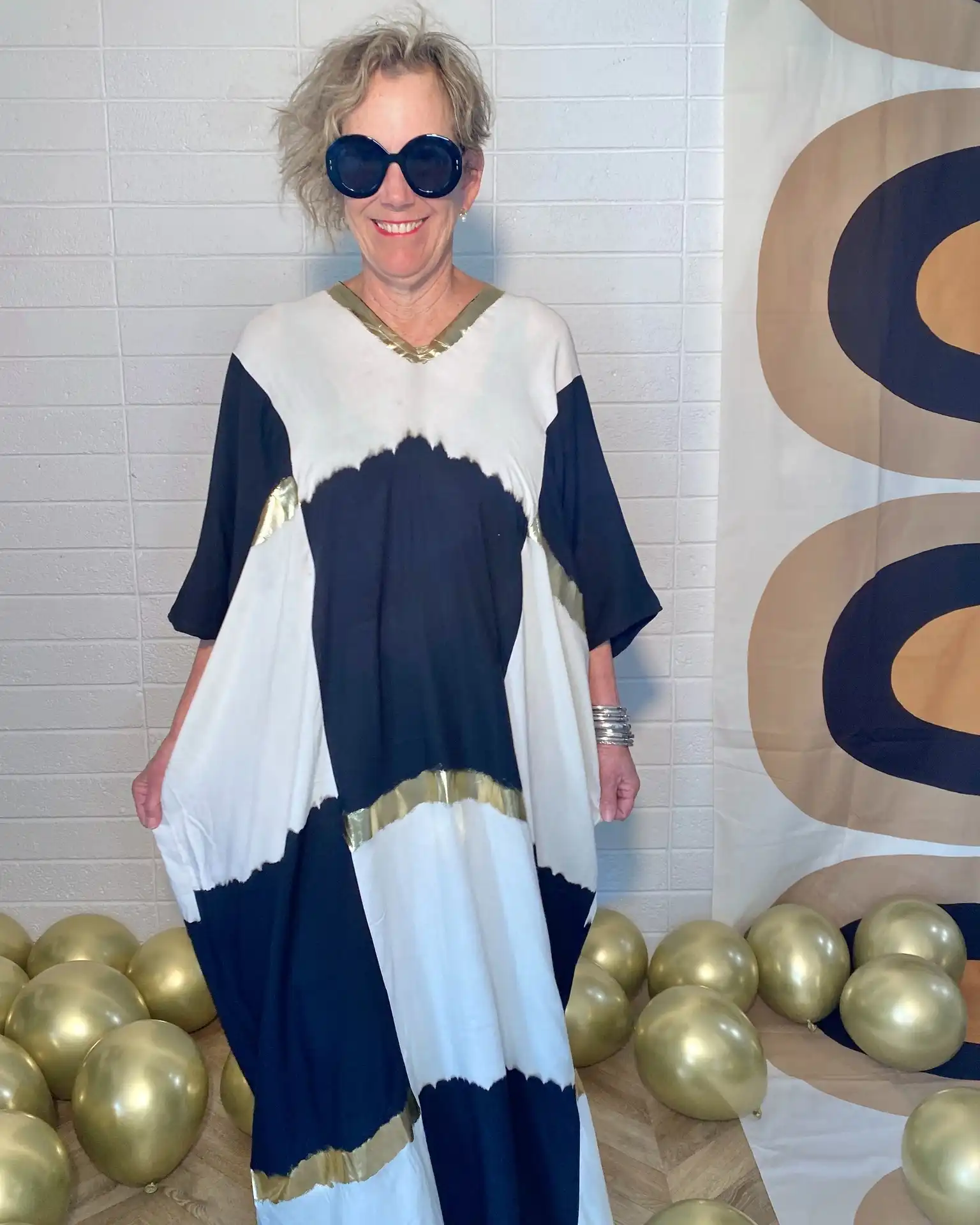 Meet one of our newest Drinking Dresses - The Kakee Kaftan in our fab Checker Party Print. 

The Checker Party print keeps it classic with simple black and cream colors, but adds in a splash of sparkle with golden bands thats run through the print.

We are going for GLAM at Drinking Dresses! Let's get this party started! 🍸 👗 

#DrinkingDresses #DrinkingDress #CocktailKaftan #Kaftan #PartyTime